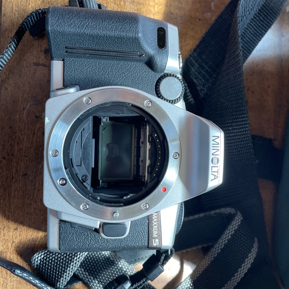Minolta Maxxum 5 Camera with all lenses and carrier case.